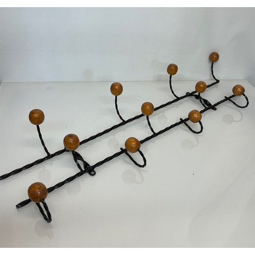 175 - Wrought iron mid century coat hanging rails, 107cm long 35 cm high.

This lot is collection only.