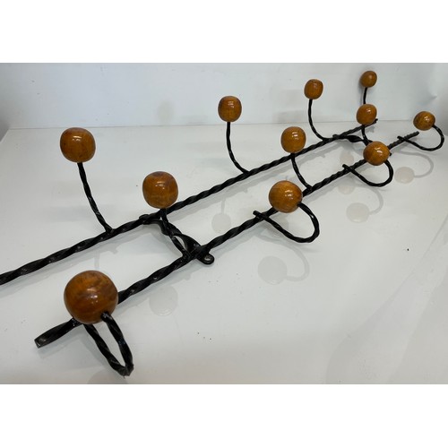 175 - Wrought iron mid century coat hanging rails, 107cm long 35 cm high.

This lot is collection only.