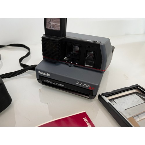 184 - Polaroid Impulse AF instant camera

This lot is available for in-house shipping