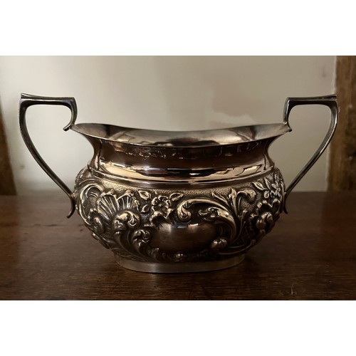 185 - Plated tea pot, milk jug and sugar bowl with embossed decoration.

This lot is available for in-hous... 