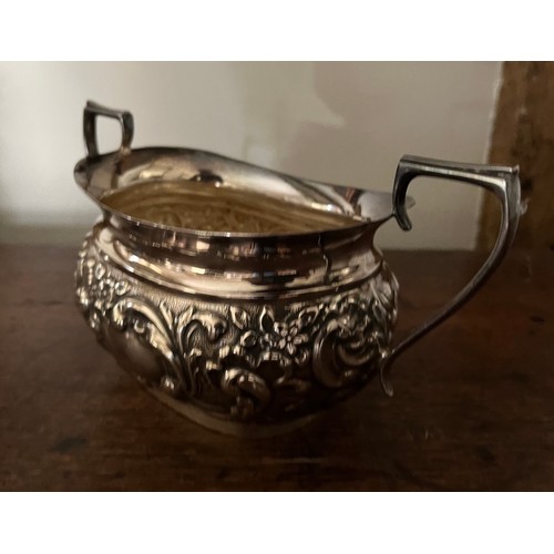 185 - Plated tea pot, milk jug and sugar bowl with embossed decoration.

This lot is available for in-hous... 