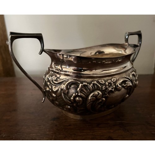 185 - Plated tea pot, milk jug and sugar bowl with embossed decoration.

This lot is available for in-hous... 