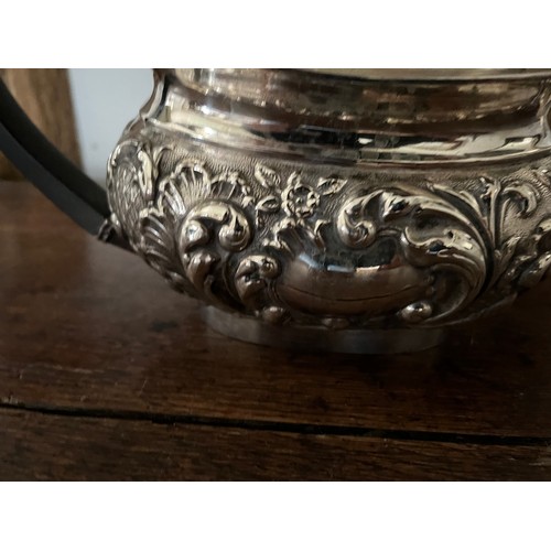 185 - Plated tea pot, milk jug and sugar bowl with embossed decoration.

This lot is available for in-hous... 