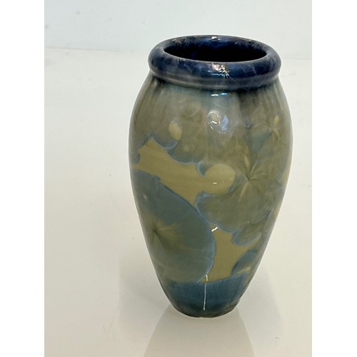 194 - Unusual small vase with an iridescent blue lustre glaze to the interior.

This lot is available for ... 