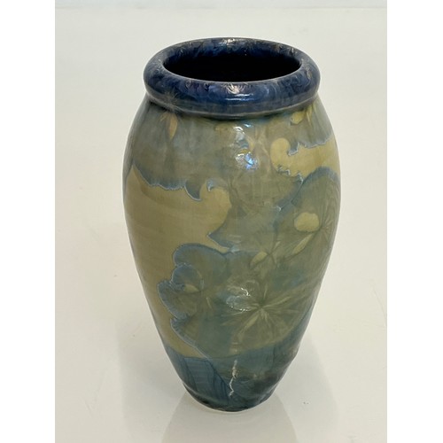 194 - Unusual small vase with an iridescent blue lustre glaze to the interior.

This lot is available for ... 