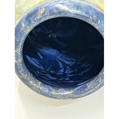 194 - Unusual small vase with an iridescent blue lustre glaze to the interior.

This lot is available for ... 