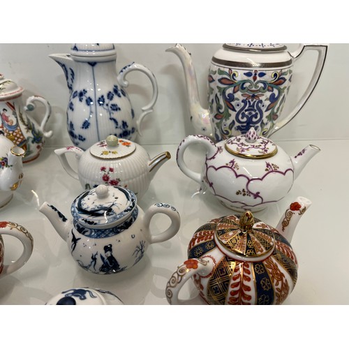 443 - A collection of twelve decorative tea pots, Spode, V & A collection, Coalport etc.

This lot is avai... 