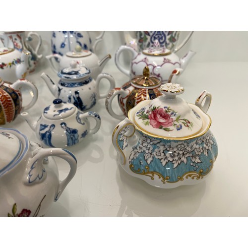 443 - A collection of twelve decorative tea pots, Spode, V & A collection, Coalport etc.

This lot is avai... 