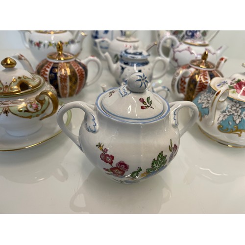 443 - A collection of twelve decorative tea pots, Spode, V & A collection, Coalport etc.

This lot is avai... 