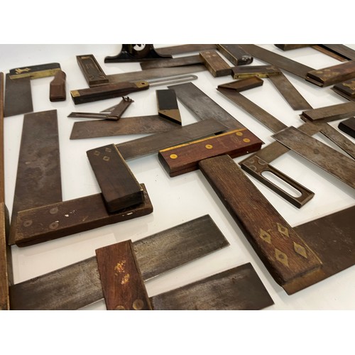 457 - A collection of set squares and others, part of a large collection of carpentry tools. 28 items in a... 