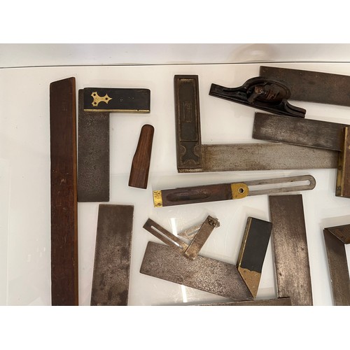 457 - A collection of set squares and others, part of a large collection of carpentry tools. 28 items in a... 