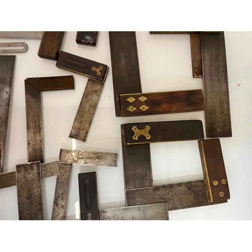 457 - A collection of set squares and others, part of a large collection of carpentry tools. 28 items in a... 