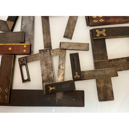 457 - A collection of set squares and others, part of a large collection of carpentry tools. 28 items in a... 