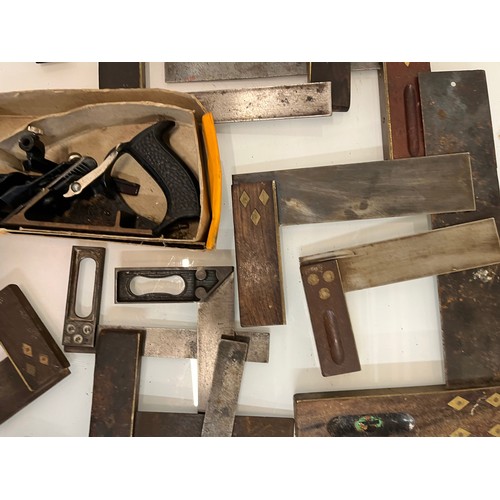 469 - A boxed wood working plane and a quantity of squares, part of a large collection of carpentry tools.... 