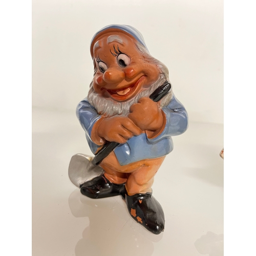 369 - Terracotta Disney Collectable, a set of mid century hand decorated Seven Dwarfs.

This lot is availa... 