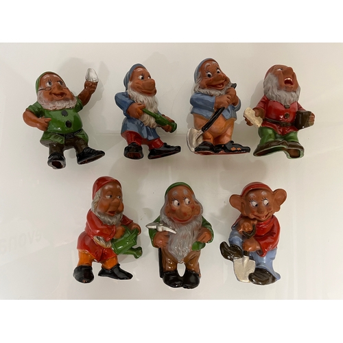 369 - Terracotta Disney Collectable, a set of mid century hand decorated Seven Dwarfs.

This lot is availa... 