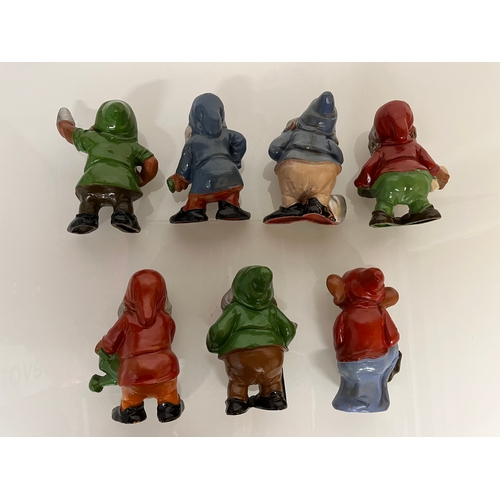 369 - Terracotta Disney Collectable, a set of mid century hand decorated Seven Dwarfs.

This lot is availa... 