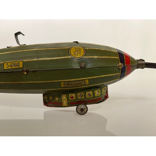 370 - Lithographed tin plate clockwork toy zepplin. 23 cm long.

This lot is available for in house shippi... 