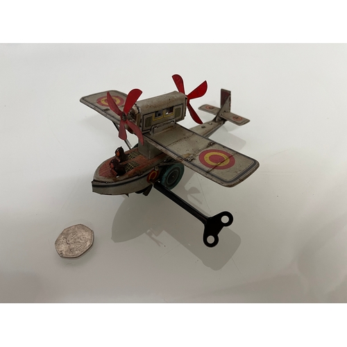 371 - lithographed tin plate toy flying boat, 17 cm long.

This lot is available for in house shipping