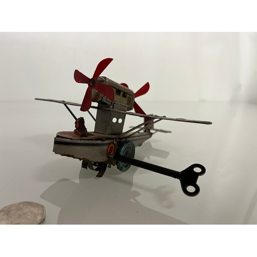 371 - lithographed tin plate toy flying boat, 17 cm long.

This lot is available for in house shipping