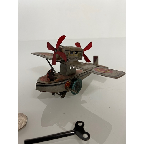 371 - lithographed tin plate toy flying boat, 17 cm long.

This lot is available for in house shipping