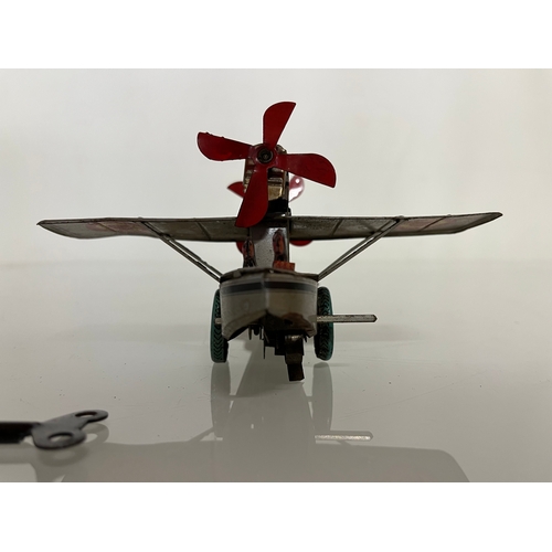 371 - lithographed tin plate toy flying boat, 17 cm long.

This lot is available for in house shipping