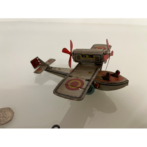 371 - lithographed tin plate toy flying boat, 17 cm long.

This lot is available for in house shipping