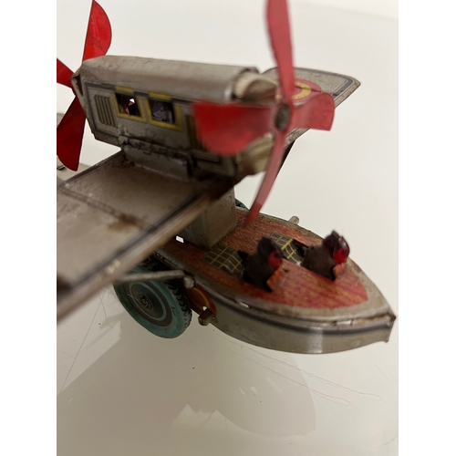 371 - lithographed tin plate toy flying boat, 17 cm long.

This lot is available for in house shipping