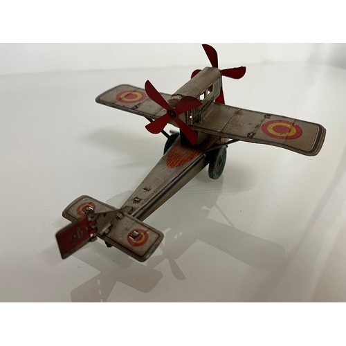 371 - lithographed tin plate toy flying boat, 17 cm long.

This lot is available for in house shipping