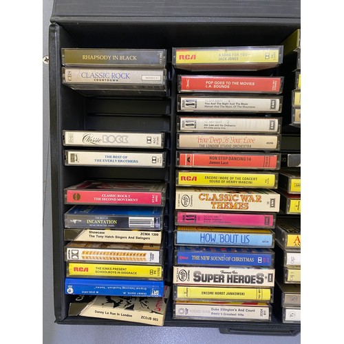 496 - Hard case containing a selection of cassette tapes. Mixture of classical, pop and rock. Selection of... 