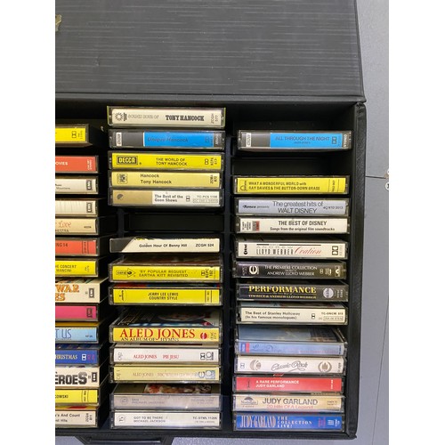 496 - Hard case containing a selection of cassette tapes. Mixture of classical, pop and rock. Selection of... 