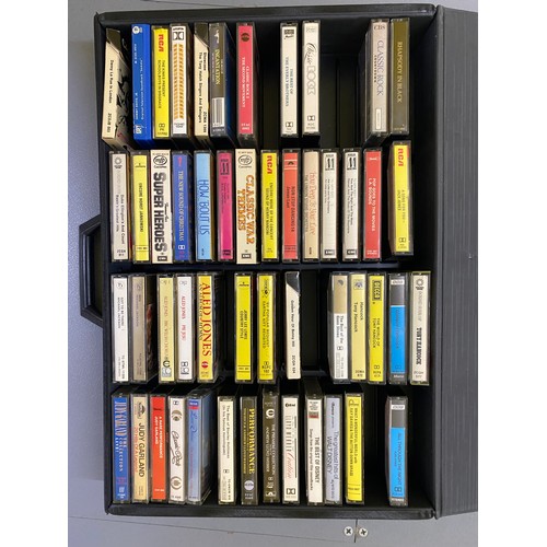 496 - Hard case containing a selection of cassette tapes. Mixture of classical, pop and rock. Selection of... 