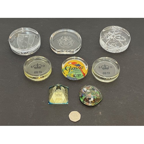 500 - A collection of 8 glass paper weights advertising paints etc, two marked for the Stationary Office.
... 