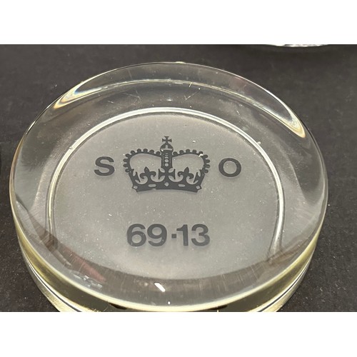 500 - A collection of 8 glass paper weights advertising paints etc, two marked for the Stationary Office.
... 