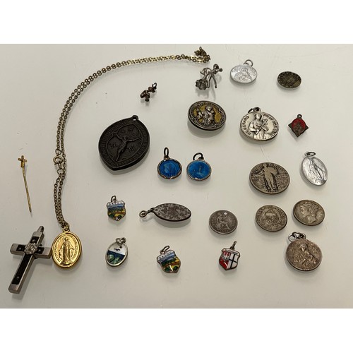 503 - A collection of charms pendants and coins.

This lot is available for in-house shipping