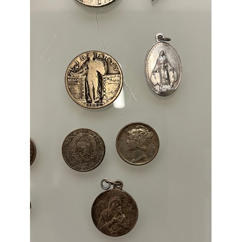 503 - A collection of charms pendants and coins.

This lot is available for in-house shipping