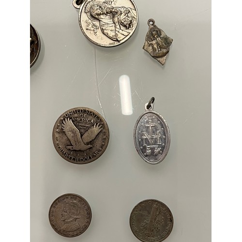 503 - A collection of charms pendants and coins.

This lot is available for in-house shipping