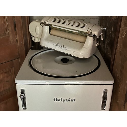 185 - A white enamelled Hotpoint washing machine and mangle.

This lot is collection only.