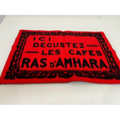 188 - A woven mat advertising Coffee Ras D’Amhara. 58 cm x 43 cm.

This lot is available for in-house ship... 