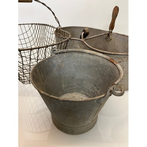 192 - A galvinised seed sewing bucket, a galvinised pail and a wire potato basket.

This lot is collection... 