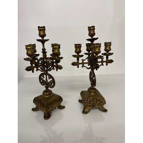 195 - A pair of ornate cast  brass four branch candlelabras.

This lot is available for in house shipping ... 