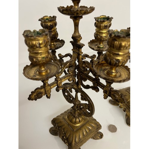 195 - A pair of ornate cast  brass four branch candlelabras.

This lot is available for in house shipping ... 