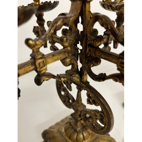 195 - A pair of ornate cast  brass four branch candlelabras.

This lot is available for in house shipping ... 