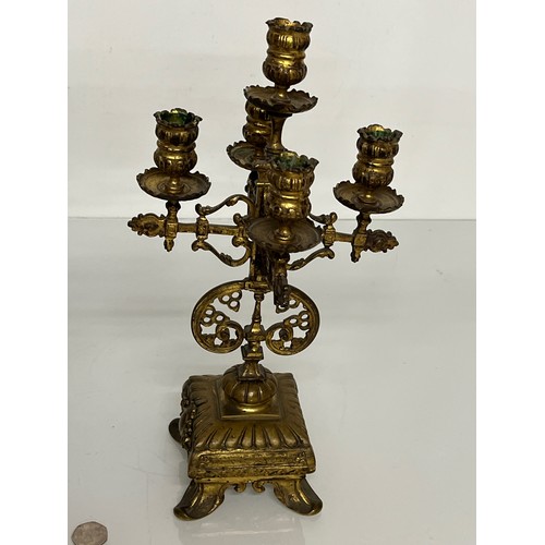 195 - A pair of ornate cast  brass four branch candlelabras.

This lot is available for in house shipping ... 