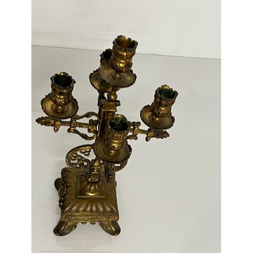 195 - A pair of ornate cast  brass four branch candlelabras.

This lot is available for in house shipping ... 