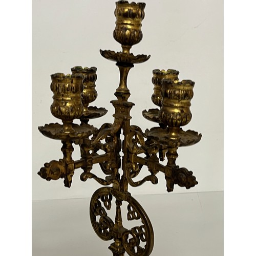 195 - A pair of ornate cast  brass four branch candlelabras.

This lot is available for in house shipping ... 