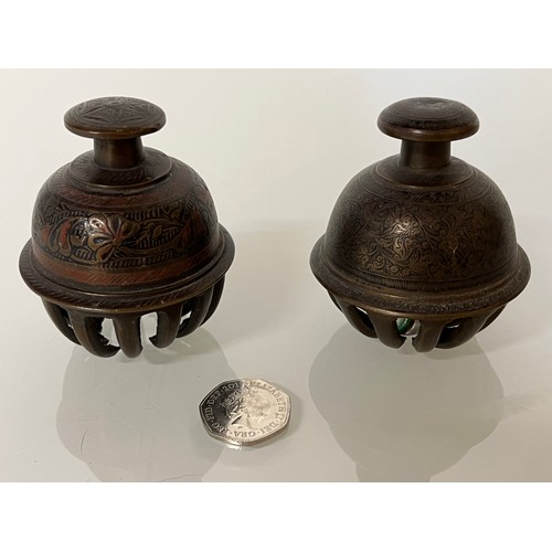 166 - Asian tribal art, two cast bronze and bells with hand chased and enamelled decoration.

This lot is ... 