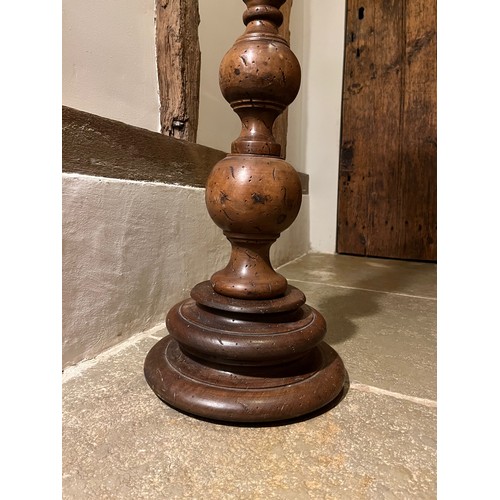 218 - Large turned wooden stand 100cm tall 17 cm diameter at the top and 30 cm diameter at the base.

This... 