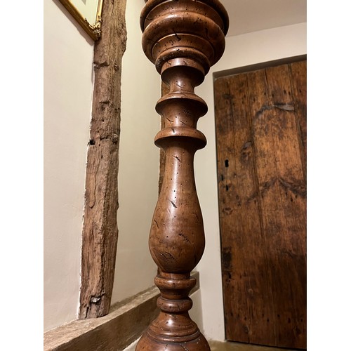 218 - Large turned wooden stand 100cm tall 17 cm diameter at the top and 30 cm diameter at the base.

This... 