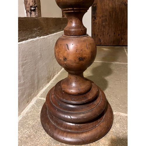 218 - Large turned wooden stand 100cm tall 17 cm diameter at the top and 30 cm diameter at the base.

This... 